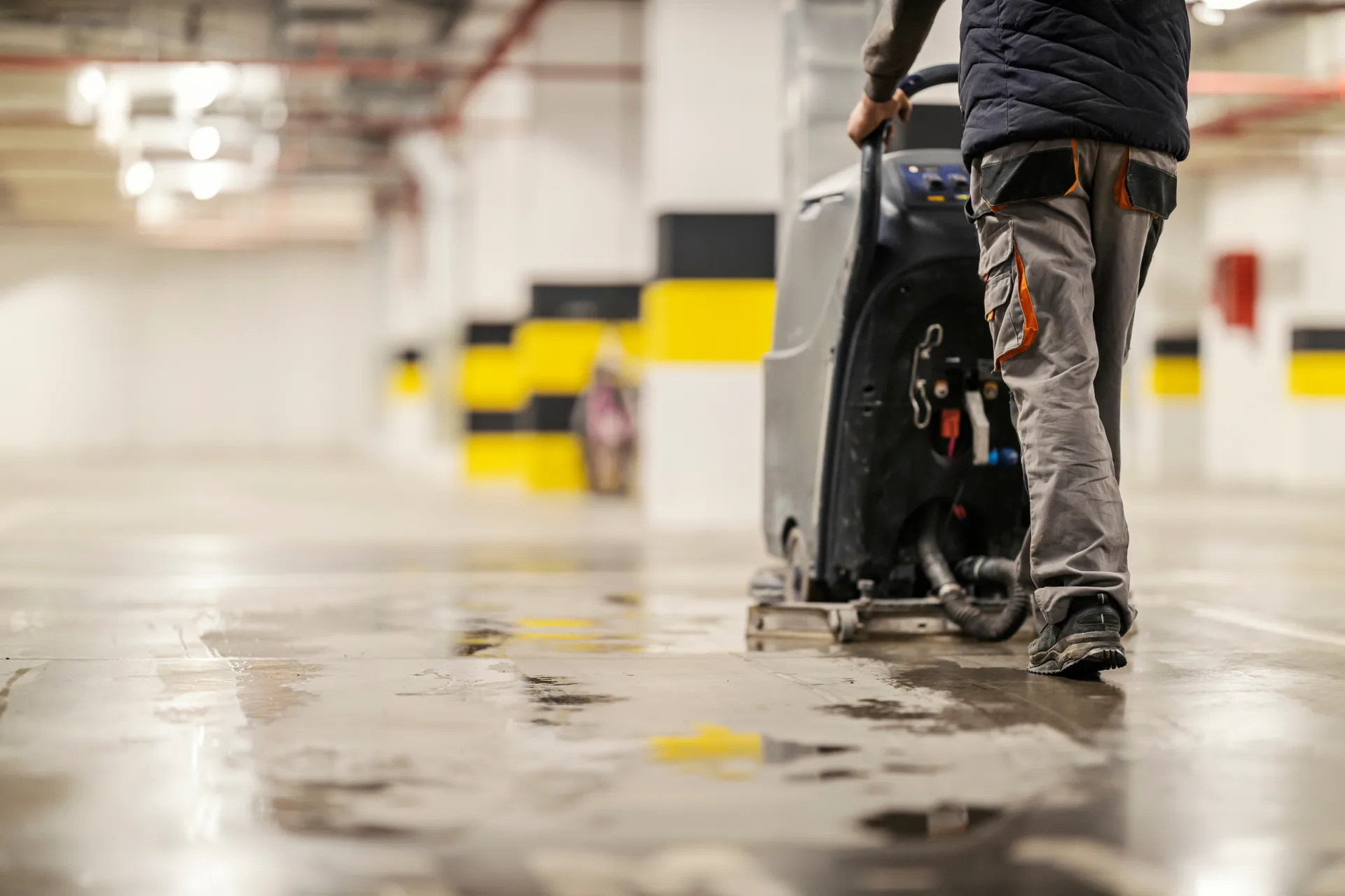 Operator scrubbing a strata car park floor in Newcastle